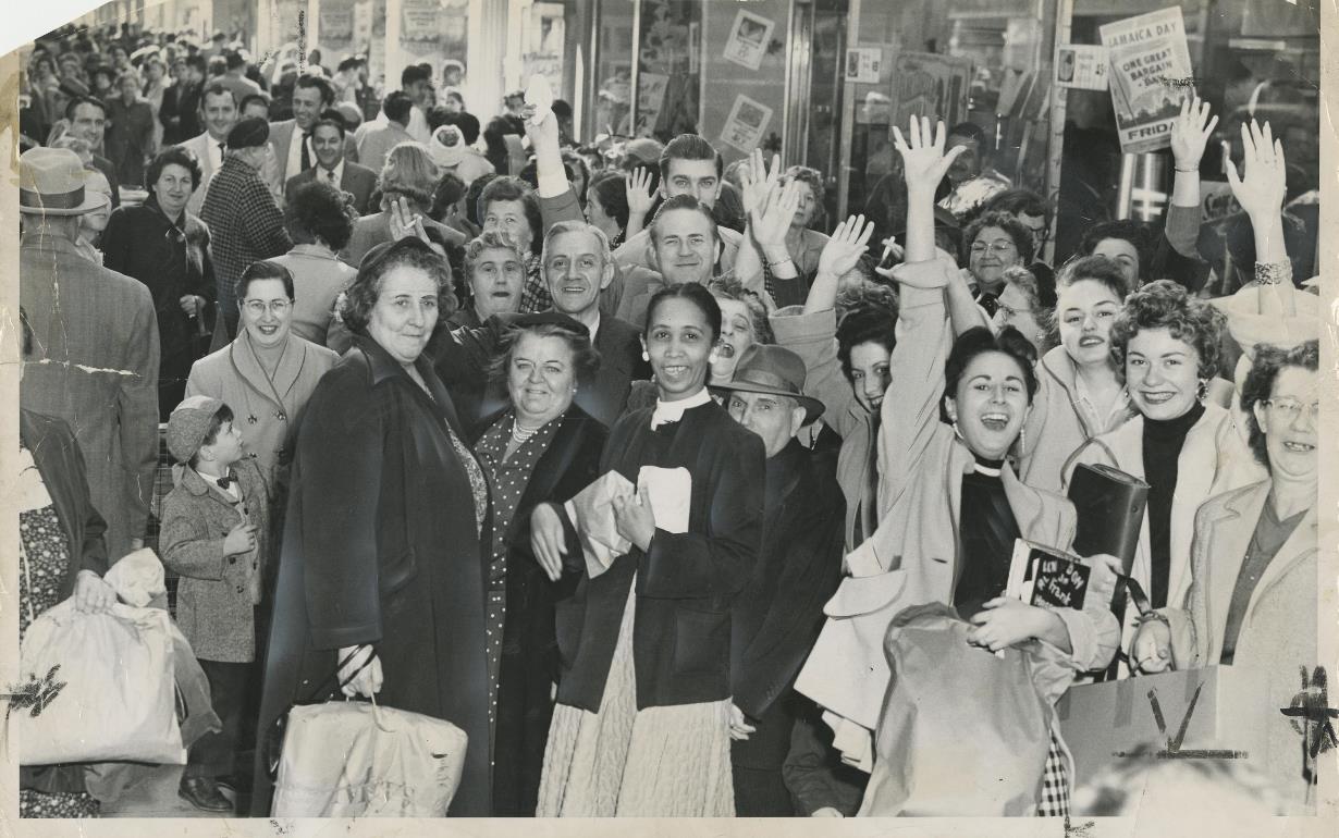 Lots of shoppers look happy to be on Jamaica Avenue during the Jamaica Day sales in October 1957.